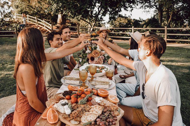DIY-MOD transforming the food in a photo of friends at a table: original, inpainted, replaced, blurred, and restyled versions